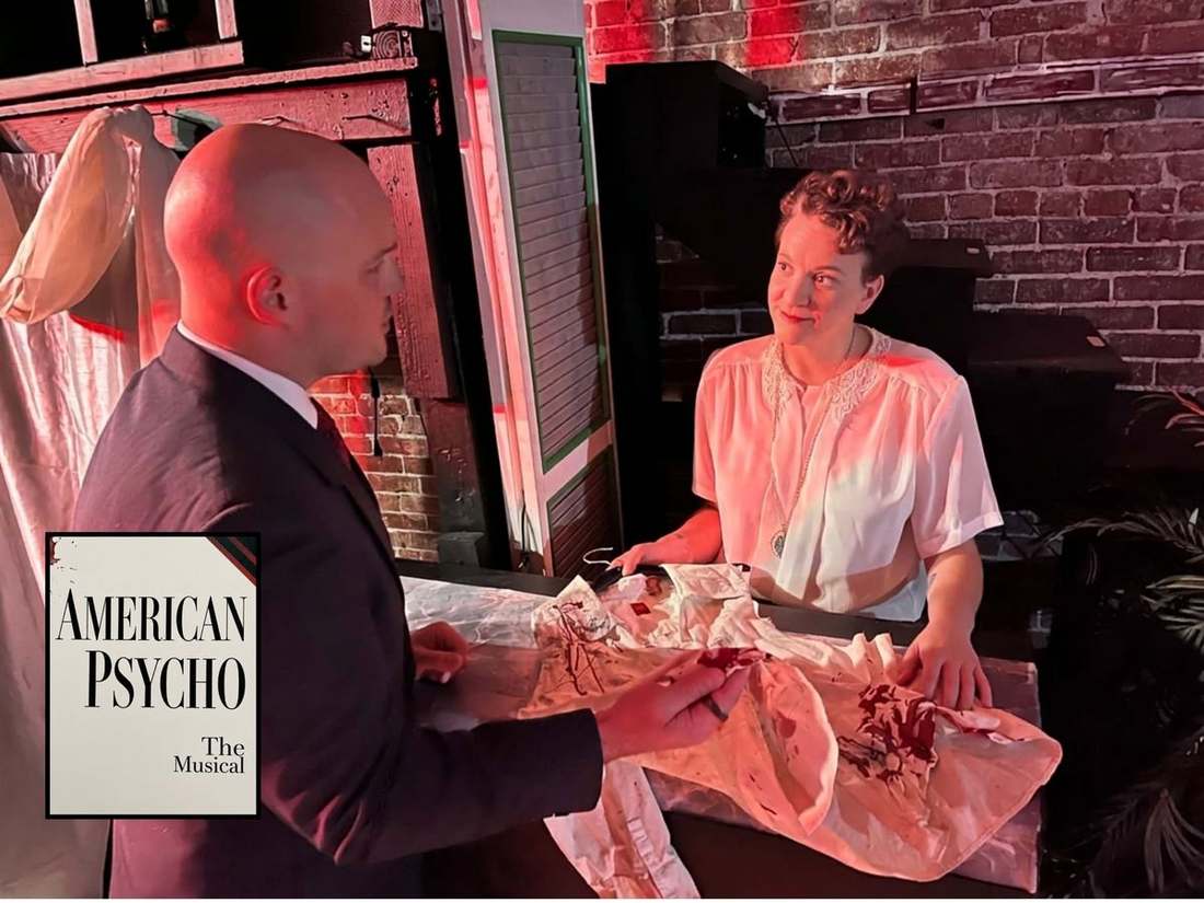 Two American Psycho cast members in a tense scene under red light