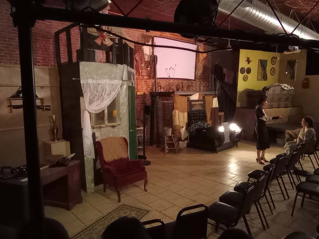 A Bonnie & Clyde performance on the studio stage, the set lit for a scene