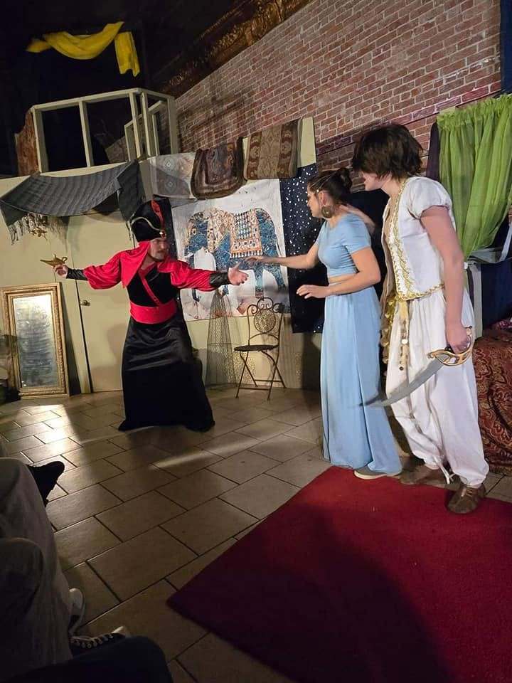 The Vizier pleads his case to the prince and princess, arms outstretched