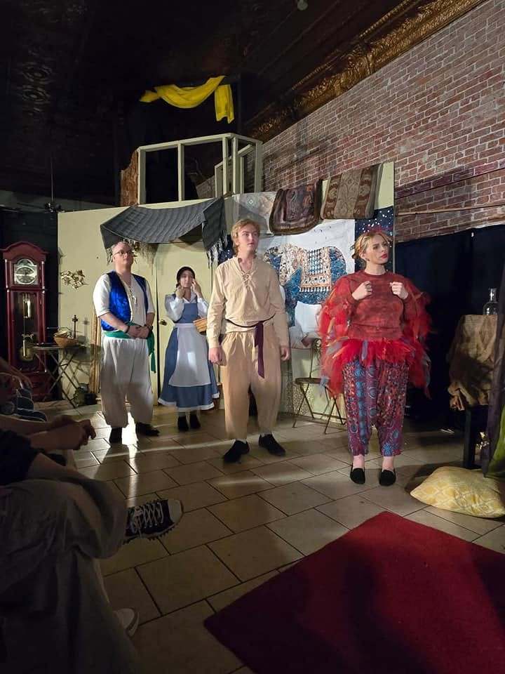 Iago joins the prince, princess, and a traveler for a group scene in Twisted