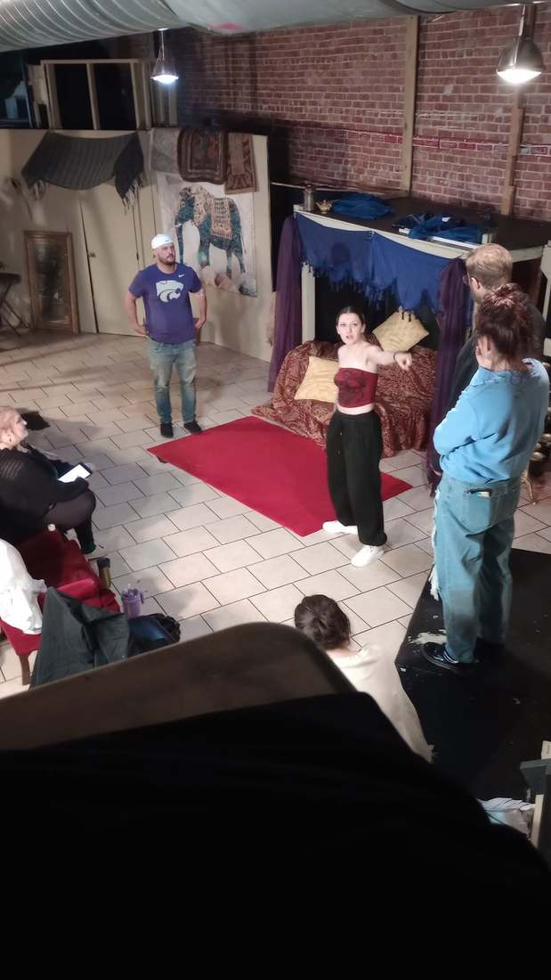 Performers work a scene on the red carpet during Twisted rehearsal
